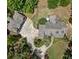 Expansive aerial view of a well-maintained property with mature landscaping and circular driveway at 193 Stonegate Trl, Carrollton, GA 30116