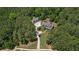 An aerial view showcases the expansive property with mature trees and ample space at 193 Stonegate Trl, Carrollton, GA 30116