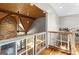 Attic features with exposed brick, lighting, and railing at 193 Stonegate Trl, Carrollton, GA 30116