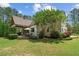 Backyard features a stone patio with outdoor seating, and lush green lawn at 193 Stonegate Trl, Carrollton, GA 30116