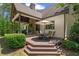Backyard deck with a dining table, chairs, and an umbrella for outdoor entertaining at 193 Stonegate Trl, Carrollton, GA 30116