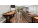 Finished basement with hardwood style floors and a shuffleboard table; perfect for games and recreation at 193 Stonegate Trl, Carrollton, GA 30116