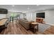 Spacious basement with hardwood floors, comfortable seating, and a shuffleboard table for entertainment at 193 Stonegate Trl, Carrollton, GA 30116