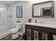 Well-lit bathroom features a sleek vanity, toilet, and shower for a relaxing and functional space at 193 Stonegate Trl, Carrollton, GA 30116