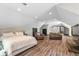 Spacious bedroom with white paint, with a king bed, wood floors, and lots of light at 193 Stonegate Trl, Carrollton, GA 30116