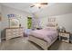 Charming bedroom with a plush bed, dresser, and desk; a serene and inviting space at 193 Stonegate Trl, Carrollton, GA 30116