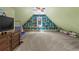 Spacious bonus room, with wall-to-wall shelving, with plenty of room for activities at 193 Stonegate Trl, Carrollton, GA 30116