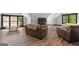 Spacious bonus room with dark hardwood floors, light-colored walls, and dark trim around the windows at 193 Stonegate Trl, Carrollton, GA 30116