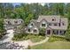 Beautiful two-story home with a detached garage, a lush green lawn, and mature trees at 193 Stonegate Trl, Carrollton, GA 30116