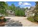 Expansive driveway leads to a five-car garage on a beautiful, wooded lot at 193 Stonegate Trl, Carrollton, GA 30116