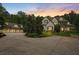 Stunning exterior showcasing well-manicured lawn and driveway leading up to a beautiful two-story home with a three-car garage at 193 Stonegate Trl, Carrollton, GA 30116