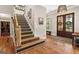 Entryway with hardwood floors, staircase, and double doors at 193 Stonegate Trl, Carrollton, GA 30116