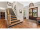 Elegant foyer with hardwood floors, staircase, and natural light at 193 Stonegate Trl, Carrollton, GA 30116