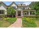 Charming two-story home with a welcoming front porch, mature landscaping, and a beautifully paved walkway at 193 Stonegate Trl, Carrollton, GA 30116