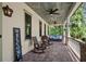 Charming front porch featuring rocking chairs, swing, and decorative accents at 193 Stonegate Trl, Carrollton, GA 30116