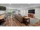Finished basement game room featuring a shuffleboard table, sofa, and television at 193 Stonegate Trl, Carrollton, GA 30116