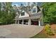 This angle displays the attached four-car garage with the house in the background at 193 Stonegate Trl, Carrollton, GA 30116