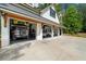 A car lift is being used to store cars inside a five-car garage at 193 Stonegate Trl, Carrollton, GA 30116