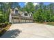 Spacious five-car garage with an upstairs living area on a beautifully landscaped lot at 193 Stonegate Trl, Carrollton, GA 30116