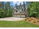 Five-car garage with living space above and beautiful landscaping around the exterior at 193 Stonegate Trl, Carrollton, GA 30116