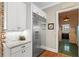 Clean kitchen featuring stainless steel refrigerator and white cabinetry at 193 Stonegate Trl, Carrollton, GA 30116