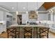 Gourmet kitchen features a large island, stainless steel appliances, and custom cabinetry at 193 Stonegate Trl, Carrollton, GA 30116
