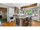 Well-equipped kitchen featuring a large island with seating, stainless appliances, and custom cabinetry at 193 Stonegate Trl, Carrollton, GA 30116