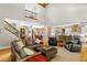 Bright open-concept living room with a kitchen and wood floors at 193 Stonegate Trl, Carrollton, GA 30116