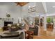 Spacious living room featuring vaulted ceilings, hardwood floors, and plenty of natural light at 193 Stonegate Trl, Carrollton, GA 30116