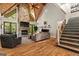 Modern living room features a stone fireplace, hardwood floors, and a vaulted ceiling at 193 Stonegate Trl, Carrollton, GA 30116