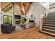 Spacious living room with stone fireplace, vaulted ceilings, and hardwood floors at 193 Stonegate Trl, Carrollton, GA 30116