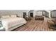 Main bedroom with hardwood floors and glass patio doors; view also shows the main bedroom sitting area at 193 Stonegate Trl, Carrollton, GA 30116