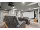Home theater with cozy reclining seats, large screen, and ambient lighting for an immersive experience at 193 Stonegate Trl, Carrollton, GA 30116