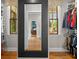 Spacious walk-in closet with built-in shelving and view to main bedroom and exterior windows at 193 Stonegate Trl, Carrollton, GA 30116