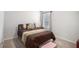 Bedroom with window and comfortable queen bed at 210 Kestrel Cir, Covington, GA 30014