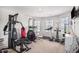 Home gym with multiple machines and natural light at 210 Kestrel Cir, Covington, GA 30014