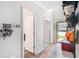 Bright foyer featuring hardwood floors, high ceilings, and a view of the front yard through the glass-paneled front door at 210 Kestrel Cir, Covington, GA 30014