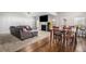 Open layout displaying the living room, dining space, and natural light, ideal for modern living and gatherings at 210 Kestrel Cir, Covington, GA 30014