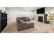 Spacious living room with plush carpeting, cozy sectional sofa, fireplace and ample natural light at 210 Kestrel Cir, Covington, GA 30014
