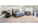 Spacious main bedroom featuring a large bed, chair, and windows with lots of natural light at 210 Kestrel Cir, Covington, GA 30014