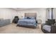 Bright main bedroom featuring a large bed, comfortable seating, and ample space at 210 Kestrel Cir, Covington, GA 30014