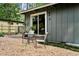 Backyard with gravel and a patio set under a large sliding glass door at 3408 Chestnut Dr, Doraville, GA 30340