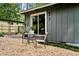 Exterior view of the home's backyard featuring a patio and stone landscaping at 3408 Chestnut Dr, Doraville, GA 30340