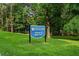 City of Doraville's Brook Park sign surrounded by lush green grass at 3408 Chestnut Dr, Doraville, GA 30340