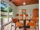 Bright dining area with glass table, modern chairs, and a sliding door to the backyard at 3408 Chestnut Dr, Doraville, GA 30340