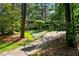 Long driveway leading up to a home with professionally maintained landscaping at 3408 Chestnut Dr, Atlanta, GA 30340
