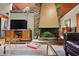 Close-up on the living room fireplace with view into the kitchen at 3408 Chestnut Dr, Doraville, GA 30340