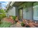Charming home featuring a brick facade, a decorative sun accent, and stylish greenery at 3408 Chestnut Dr, Atlanta, GA 30340