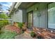 Exterior shot of a house with a brick foundation, green paint and dark trim at 3408 Chestnut Dr, Doraville, GA 30340