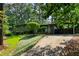 Charming single-story home with a well-manicured lawn and a covered parking area at 3408 Chestnut Dr, Doraville, GA 30340